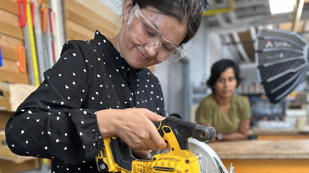 Woman holding circular saw training